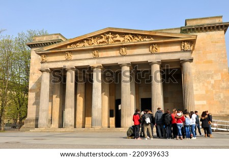 BERLIN, GERMANY - MARCH 30, 2014: Group of tourists visit monument in Berlin, Germany