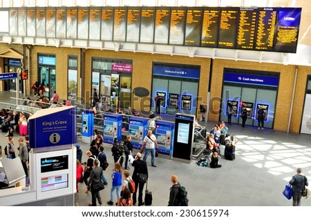 LONDON, UK - JULY 9, 2014: People transit the King's Cross train station in central London.