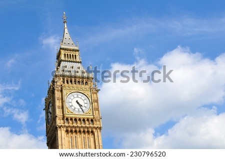 Architectural detail of the Big Ben in London, UK against blue sky and copyspace