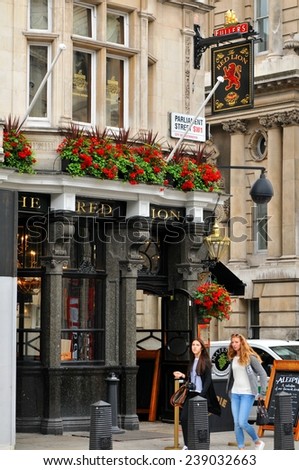 LONDON, UK. JULY 9, 2014: Facade of The Red Lion traditional British pub in central in central London