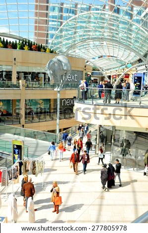 LEEDS, UK - APRIL 17, 2015: People shop inside the Trinity shopping centre in Leeds, England.