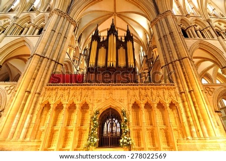 Lincoln, UK - April 9, 2015: Architectural detail of medieval organ inside Lincoln Cathedral, major landmark and the third largest cathedral in Britain.
