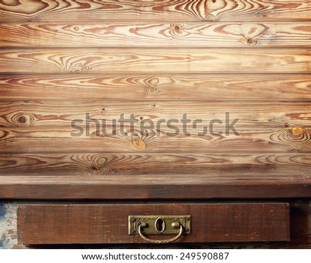 wooden table against a wall from boards
