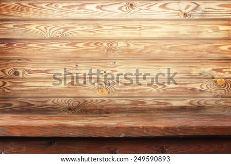 wooden table against a wall from boards