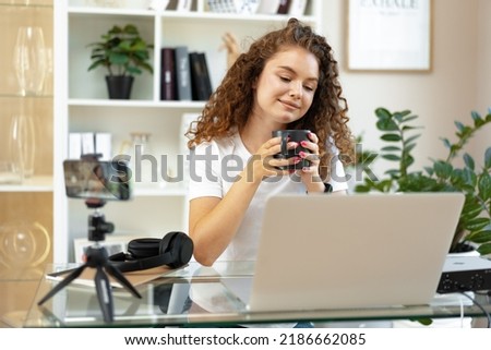 Similar – Image, Stock Photo Fashion blogger recording video at home