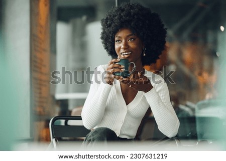 Similar – Image, Stock Photo Dreamy young lady drinking hot beverage near window with adorable weiro bird on shoulder