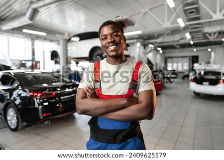 Image, Stock Photo young male mechanic works in his home workshop