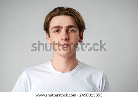 Similar – Image, Stock Photo Serious young stylish guy standing near shabby wall on street