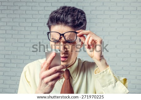 Young man looking at mobile phone