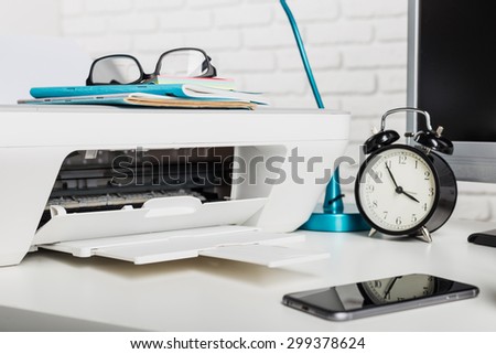 Working place of a business person. Computer, printer and other office supplies