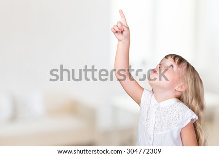 Little girl pointing up