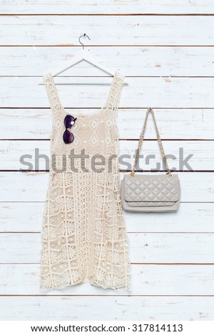 Modern woman\'s fashionable clothes on white wooden background
