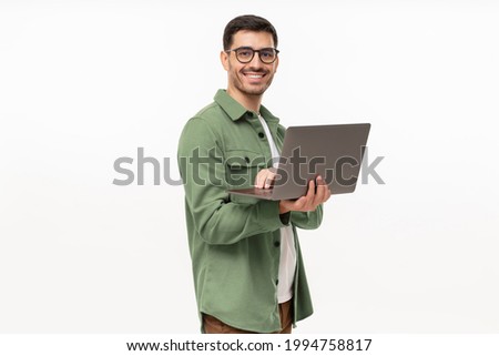 Similar – Image, Stock Photo Young man holding a small plant of cactus with his left hand. He’s in the center of the image. The background is yellow. The cactus is inside a brown vase