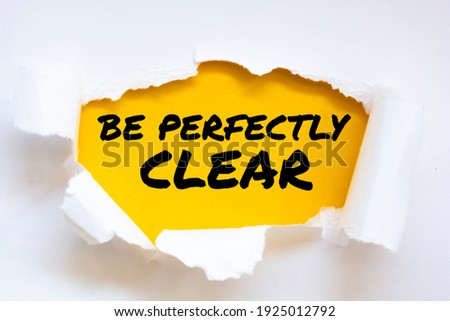 BE PERFECTLY CLEAR message written under torn paper. Business, technology, internet concept. 商業照片 © 