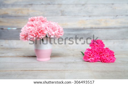 Pink Carnation fresh flowers in vase  on wood backgrounds