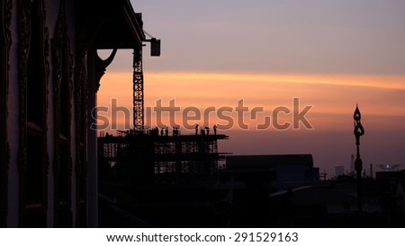 silhouette of construction worker on construction site