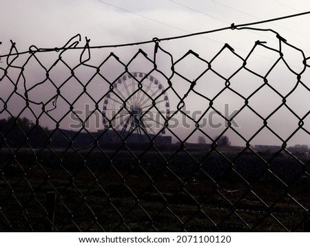 Similar – Image, Stock Photo barbed wire and carousel in amusement park in Chernobyl