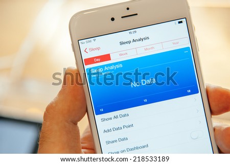 PARIS, FRANCE - SEPTEMBER 20, 2014: Hand holding a iPhone 6 Plus displaying the new Health App and Sleep Analysis module during the sales launch of the latest Apple Inc. smartphones at the Apple store