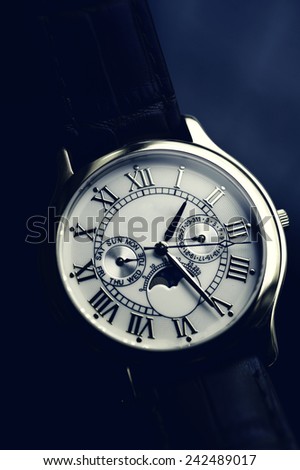 Luxury hand watch with leather wrist let stylised with Instagram retro blue effect