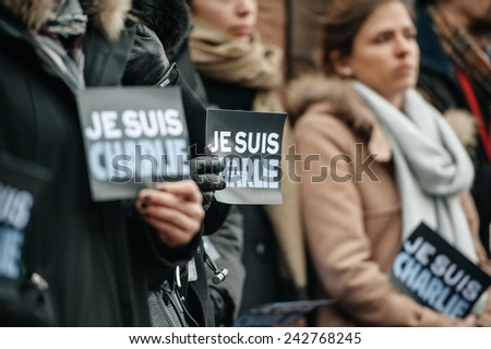 STRASBOURG, FRANCE - JANUARY 09, 2015: Council of Europe employees attend to a silent vigil to condemn the gun attack magazine Charlie Hebdo office in Paris, which killed 12 people on January 7, 2015