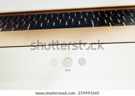 PARIS, FRANCE - MAR 10, 2015: Apple Computers website on MacBook Retina in room environment showcasing new MacBook colors as seen on 10 March, 2015