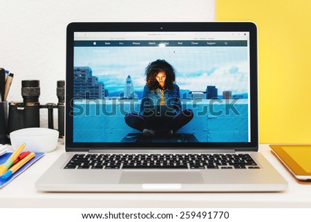 PARIS, FRANCE - MAR 10, 2015: Apple Computers website on MacBook Retina in room environment showcasing MacBook dedicated page as seen on 10 March, 2015
