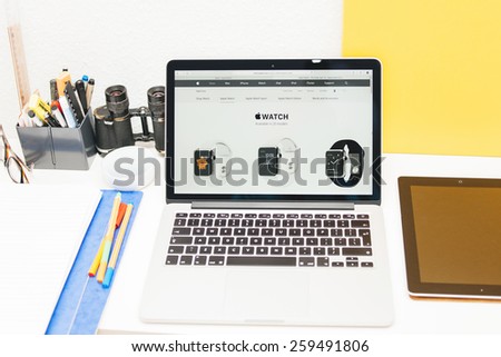 PARIS, FRANCE - MAR 10, 2015: Apple Computers website on MacBook Retina in room environment showcasing Apple Watch available in 20 models  as seen on 10 March, 2015