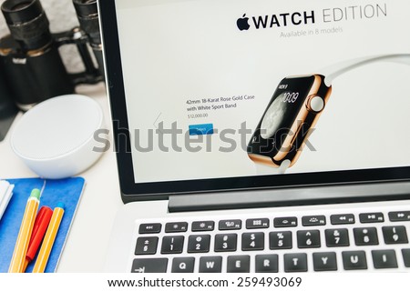 PARIS, FRANCE - MAR 10, 2015: Apple Computers website on MacBook Retina in room environment showcasing the price of 12000 USD for the golden Apple Watch Edition as seen on 10 March, 2015