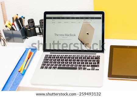 PARIS, FRANCE - MAR 10, 2015: Apple Computers website on MacBook Retina in room environment showcasing the new MacBook Golden Color as seen on 10 March, 2015