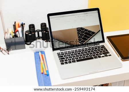 PARIS, FRANCE - MAR 10, 2015: Apple Computers website on MacBook Retina in room environment showcasing specs of new MacBook as seen on 10 March, 2015 with a tilt-shift lens