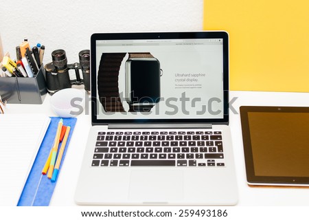 PARIS, FRANCE - MAR 10, 2015: Apple Computers website on MacBook Retina in room environment showcasing Apple Watch with Ultra Hard Saphire Display as seen on 10 March, 2015