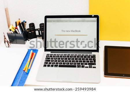 PARIS, FRANCE - MAR 10, 2015: Apple Computers website on MacBook Retina in room environment showcasing how thin the new MacBook is  as seen on 10 March, 2015