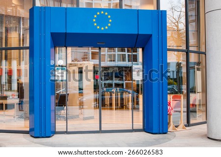 STRASBOURG, FRANCE - MARCH 24, 2015: Entrance to Council of Europe European Union with blue gate and European Union Stars logo above and white security code badge on the door.