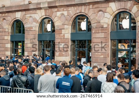 STRASBOURG, FRANCE - SEPTEMBER 19, 2014: Customers wait in line outside the Apple Inc. store during the sales launch of the iPhone 6 and iPhone 6 Plus in Europe, on Friday, Sept. 19, 2014.