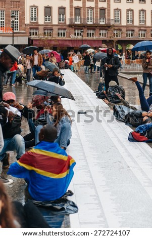 STRASBOURG, FRANCE - APR 26 2015: Die-in protest against immigration policy and border management which asks for commitment in the wake of migrants boat disasters