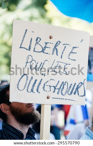 STRASBOURG, FRANCE - JULY 11, 2015: Freedom for Uyghur - Uyghur human rights activists participate in a demonstration to protest against Chinese government\'s policy in Uyghur