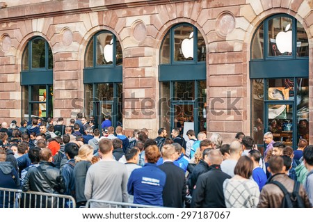 STRASBOURG, FRANCE - SEPTEMBER 19, 2014: Customers wait in line outside the Apple Inc. store during the sales launch of the iPhone 6 and iPhone 6 Plus in Europe