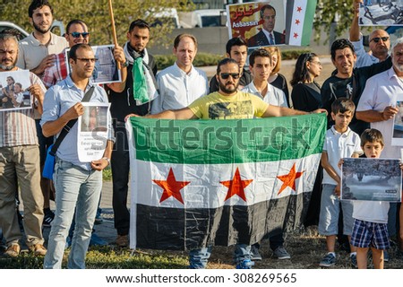 STRASBOURG, FRANCE - AUG 20, 2015: People protesting in front of European Parliament denouncing the Syrian airstrikes on a Damascus suburb of Douma which killed more than 80 people