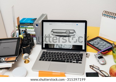 PARIS, FRANCE - SEP 10, 2015: Apple Computers website on MacBook Pro Retina in a creative room environment showcasing the newly announced 7000 Series Aluminum on Apple Watch