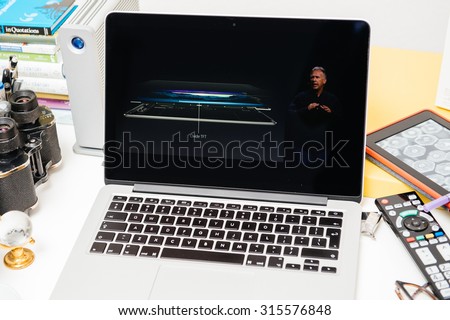 PARIS, FRANCE - SEP 10, 2015: Apple Computers website on MacBook Pro Retina in a creative room environment showcasing Philip Schiller from Apple talking about display of iPad Pro