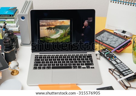 PARIS, FRANCE - SEP 10, 2015: Apple Computers website on MacBook Pro Retina in a creative room environment showcasing Philip Schiller from Apple talking about resolution of iPad Pro