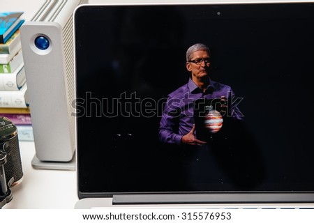 PARIS, FRANCE - SEP 10, 2015: Apple Computers website on MacBook Pro Retina in a creative room environment showcasing Apple Event with Tim Cook holding the new iPad