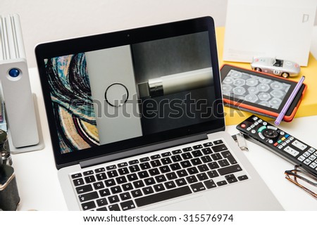 PARIS, FRANCE - SEP 10, 2015: Apple Computers website on MacBook Pro Retina in a creative room environment showcasing the newly announced Apple Pencil