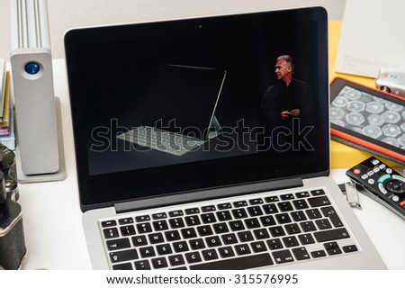 PARIS, FRANCE - SEP 10, 2015: Apple Computers website on MacBook Pro Retina in a creative room environment showcasing Philip Schiller from Apple talking about Smart Keyboard of iPad Pro