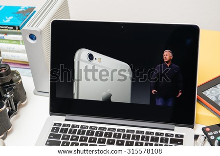 PARIS, FRANCE - SEP 10, 2015: Apple Computers website on MacBook Pro Retina in a creative room environment showcasing the newly announced iPhone 6s with revolutionary camera