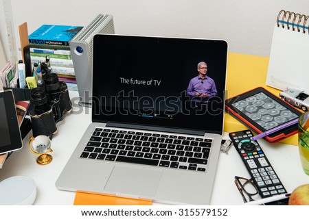 PARIS, FRANCE - SEP 10, 2015: Apple Computers website on MacBook Pro Retina in a creative room environment with Tim Cook and New Apple TV