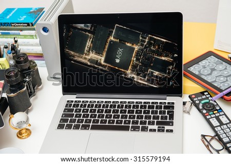 PARIS, FRANCE - SEP 10, 2015: Apple Computers website on MacBook Pro Retina in a creative room environment showcasing the newly announced iPad Pro A9X chip
