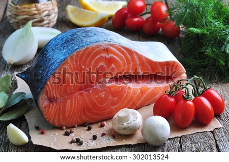 raw salmon steak with cherry tomato, mushroom, onions, dill, garlic, lemon, olive oil and laurel leaf