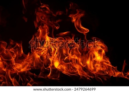 Similar – Image, Stock Photo The flame of a candle is blown aside by the wind in the darkness