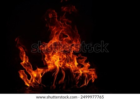 Similar – Image, Stock Photo The flame of a candle is blown aside by the wind in the darkness